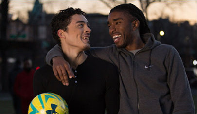 Soccer teammates smiling after a game.
