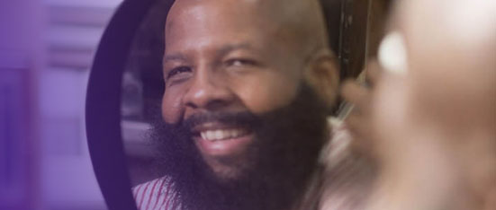 Person admiring mirror reflection.