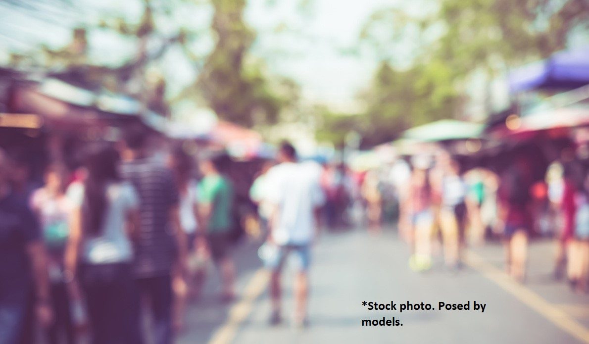 Blurred scene of street fair.