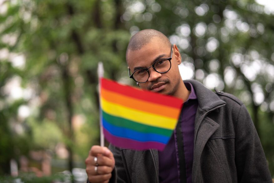 African Gay Man Waving Rainbow Flag